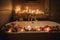 candlelit bathtub surrounded by candles and fresh blooms