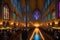 Candlelit Cathedral Interior During a Solemn Mass: Precisely Aligned Pews Filled with Devoted Attendees