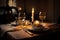 candlelit dinner for two, with glasses of wine and silverware on the table