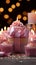 Candles aglow on cupcake, pink ribbonwrapped gift a joyous birthday scene