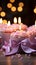 Candles aglow on cupcake, pink ribbonwrapped gift a joyous birthday scene