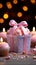 Candles aglow on cupcake, pink ribbonwrapped gift a joyous birthday scene