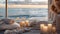 candles amidst an ocean view backdrop, accompanied by pillows, towels, and blankets, ample empty space for text to