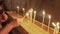 Candles being lit in the church of the holy sepulchre