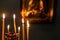 candles burn with blurred icon on background