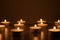 Candles burning in the darkness, devotional and religious image