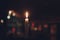 Candles Burning at Night. White Candles Burning in the Dark with focus on single candle in foreground.