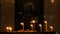 Candles are burning in the old Christian church in the dark. Religion and traditions