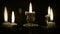 Candles in candelabrum with five branches in full dark