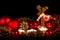 Candles with christmas wooden deer in atmospheric light