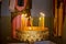Candles in the church in the gold coated holder, blurred background