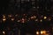 Candles flames illuminating a cemetery