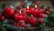 Candles flicker in festive wreath with pine cones and baubles