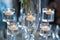 Candles floating in stemware for wedding table