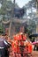 Candles and incence sticks burning in front of a temple pagoda