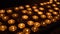 Candles inside a catholic church on a candle rack.