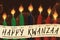 Candles of Kwanzaa with a Scroll with the Seven Principles, Vector Illustration