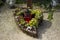 Candles and lanterns with greenery in the cemetery