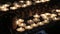 Candles light in church. Dark background.