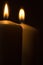 Candles lights burning close-up plain background