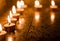 Candles lit on the occasion of deepavali, a hindu festival of light with selective focus on candle and background and foreground