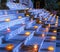 Candles shining in a glass lead the way to the temple`s