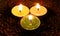 Candles on Split pea background,Isolated Green,Yellow And White candles on the seeds