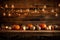 Candles And String Lights Illuminate Rustic Table Adorned With Pumpkins, Creating Warm Thanksgiving Ambiance