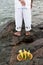 Candomble admirers are seen on top of a rock on the beach, paying homage to Iemanja with gifts