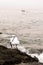 Candomble admirers are seen on top of a rock on the beach, paying homage to Iemanja with gifts