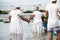 Candomble people enter the waters of Rio Vermelho beach to offer gifts to Yemanja