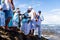 Candomble people are on the rocks of Rio Vermelho beach, offering gifts to Yemanja