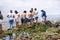 Candomble people are on the rocks of Rio Vermelho beach, offering gifts to Yemanja