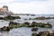 Candomble people are on the rocks of Rio Vermelho beach, offering gifts to Yemanja