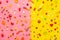 Candy assorted layout. Layout with candy on a yellow-pink background. Chewy marmalade and small caramels . Bright background.