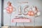 Candy bar and balloons, number 16 from balloons for birthday celebrations