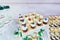 Candy bar. White festive table with deserts, tartlet and cupcakes. Wedding. Reception Tartlets