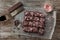 Candy Cane Chocolate Brownies Cut in Squares on Rustic Wood Background