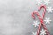 Candy cane. Christmas decors with gray background.