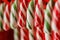 Candy cane. Christmas sweetness. Closeup. Solid festive caramel.