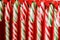 Candy cane. Christmas sweetness. Closeup. Solid festive caramel.