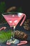 Candy cane vodka, traditional christmas peppermint pink cocktail in martini glass