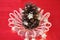 Candy Canes in a Crystal Bowl with a Large Pine Cone looking like a Christmas Tree with Christmas Lights