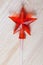 Candy caramel transparent red star on the wooden table white board