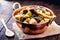 Candy in a copper pot on a rustic table. Rapadura is a sugar cane-based sweet, of African origin and consumed in Latin America, in