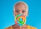 Candy, lollipop and portrait a woman in studio for wow sweets, rainbow and creative advertising. Happy black female