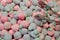 Candy marshmallows in the form of berries: raspberries, blackberries with tongs for sale by weight