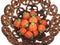 Candy pumpkins in nut shell bowl