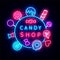 Candy shop neon signboard with lots of sweets. Round layout with text. Sweet store logo. Vector stock illustration