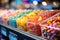 Candy store counter brimming with colorful dragee and jelly candies